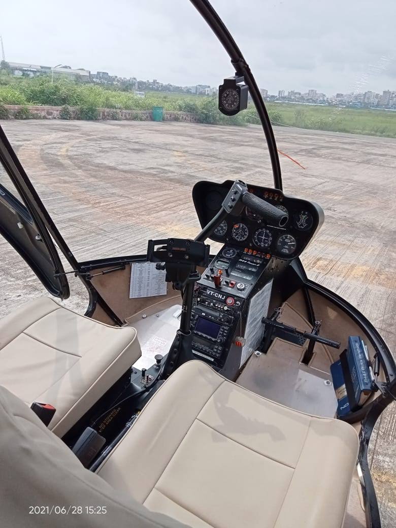 Robinson R44 soaring over Mumbai